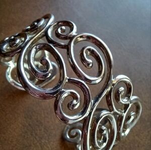 Silver swirls cuff.